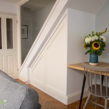 Traditional style under stairs storage